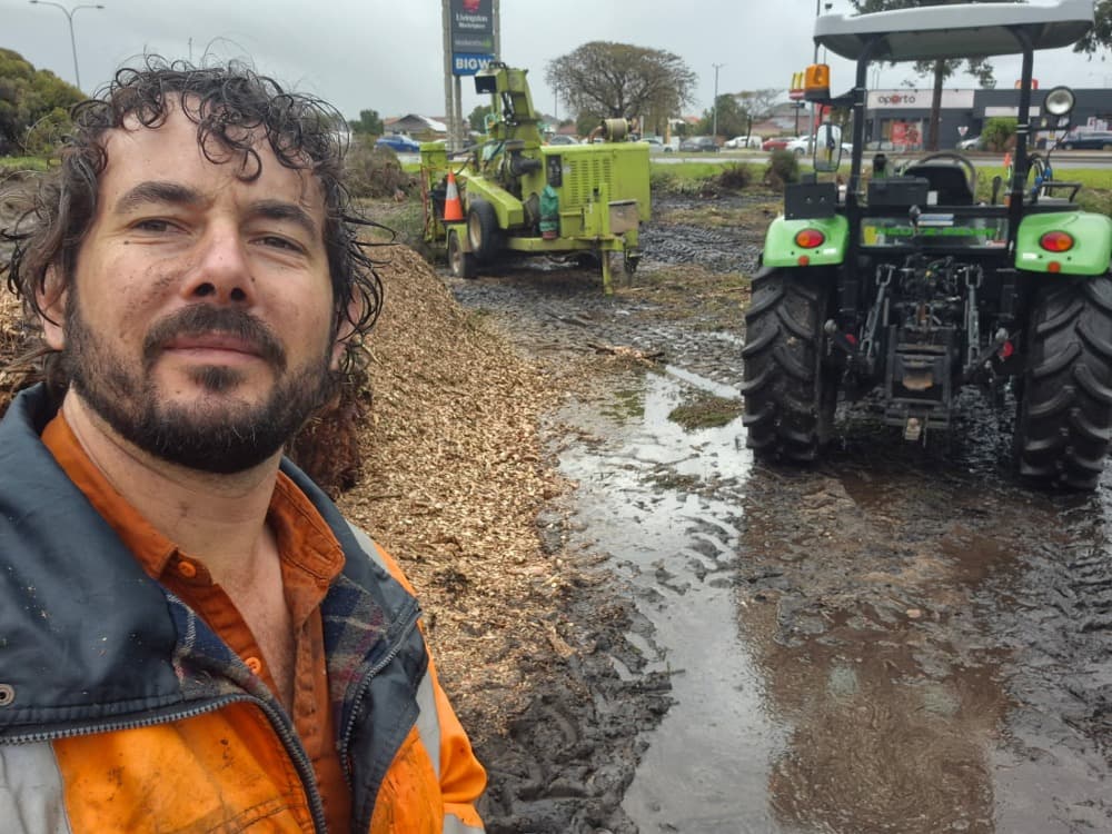 Land clearing with tractor and chipper